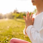 A person practices yoga and meditation.