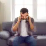 A man experiences symptoms of a silent anxiety attack.